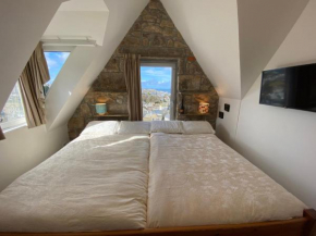 THE PENTHOUSE APARTMENT with an 18ft by 14ft balcony with amazing VIEWS over ST IVES HARBOUR and BAY perfect from Alfresco dining and sunbathing, ONSITE PARKING, LARGER GROUPS book our connecting apar
